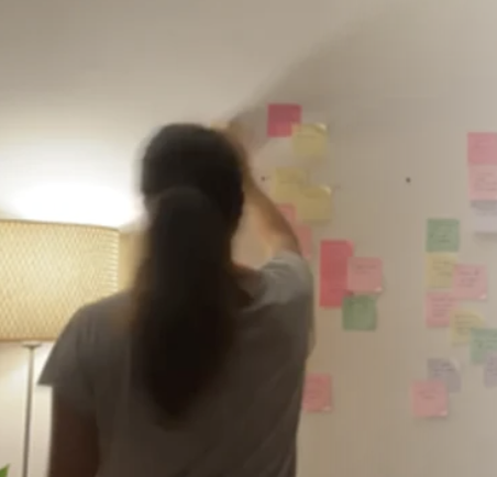 Organising colourful sticky notes during an ideas session